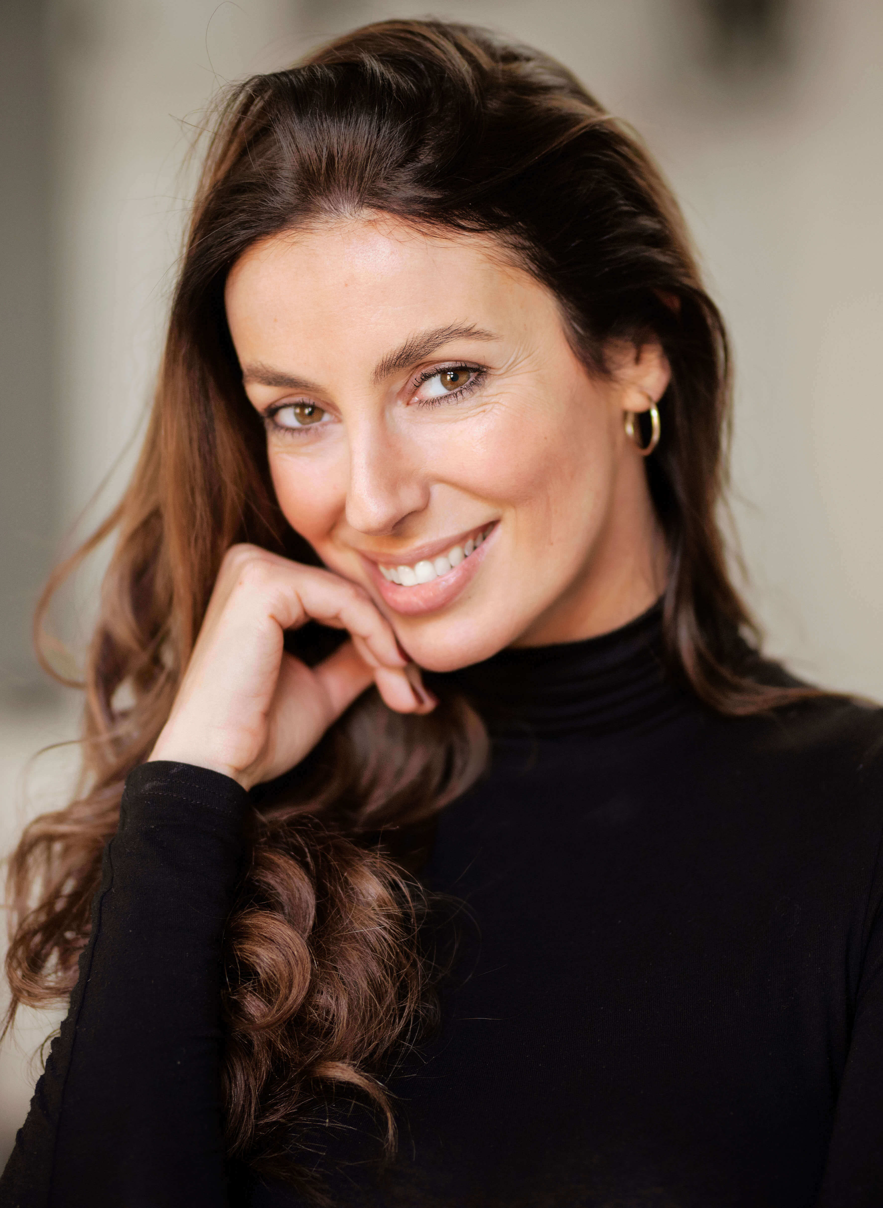 Woman with wavy hair smiling