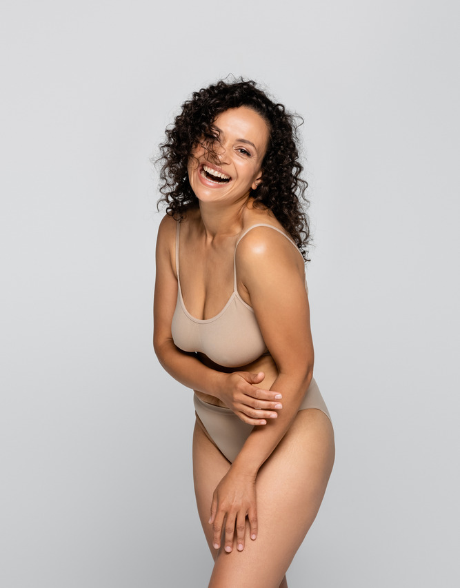 Photo of a happy woman after a fat transfer procedure